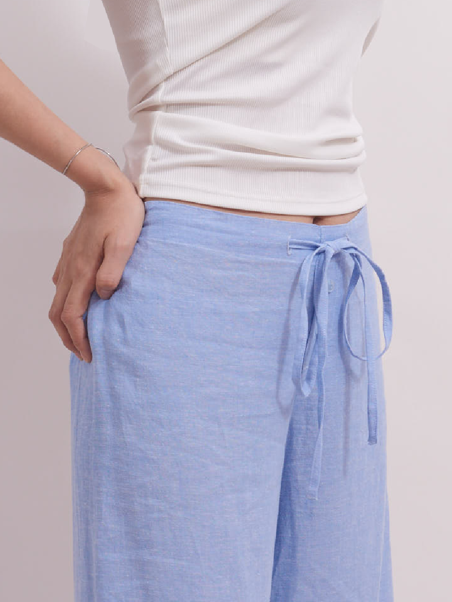 Side view showing the waistband on baby blue slim-fit linen lounge pants, perfect for smart casual and work-from-home wear
