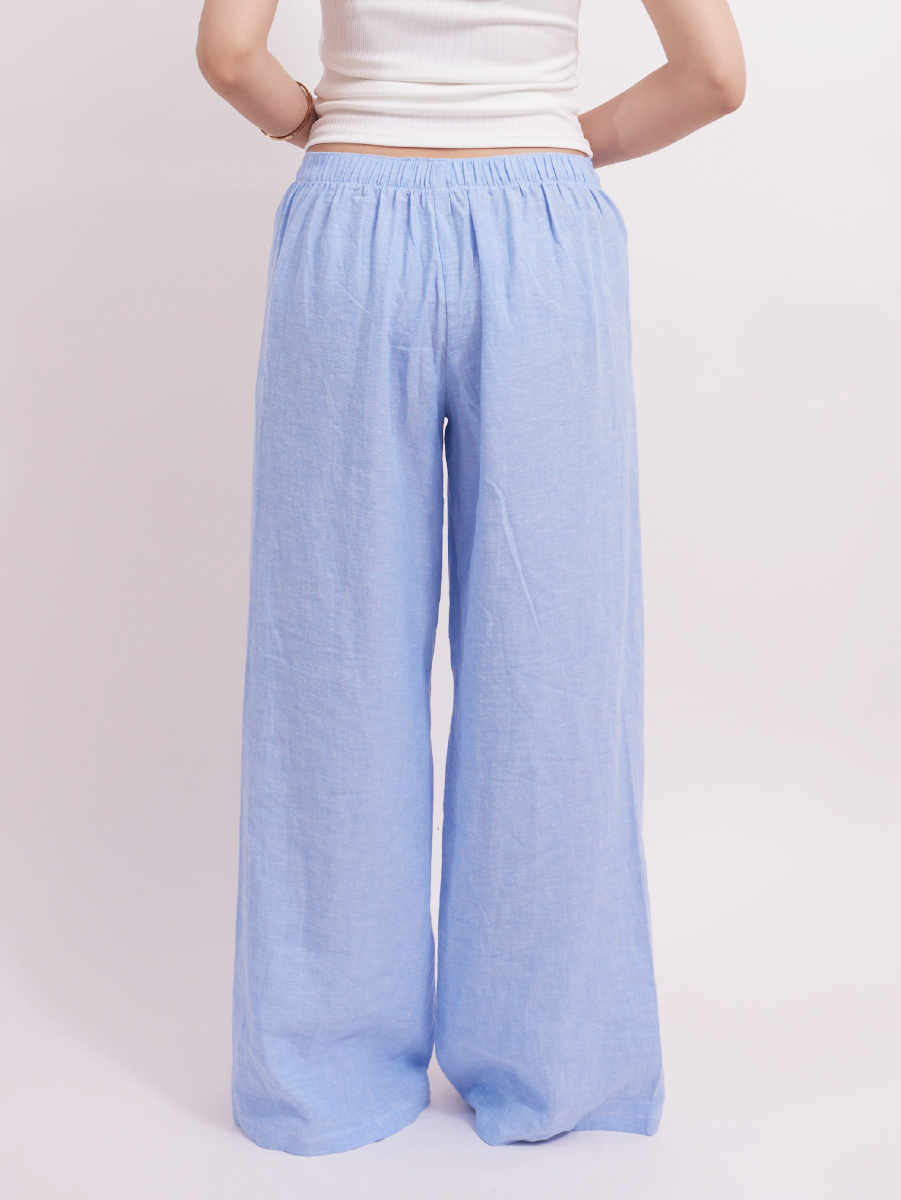 Back view showing elastic waistband on baby blue slim-fit linen lounge pants, offering a smart, snug fit for home and casual wear.
