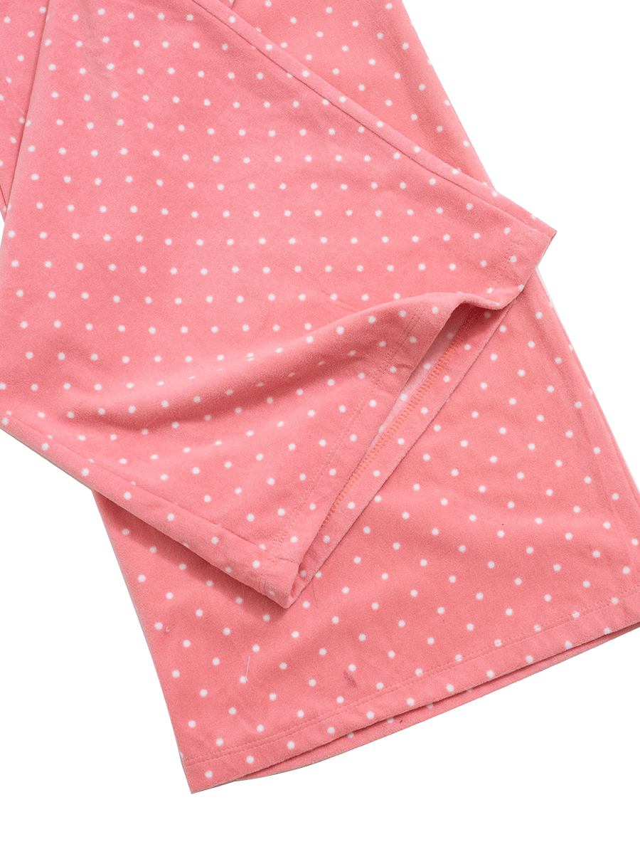 Hem detail of wide leg pink polka dot fleece lounge pants, warm and fuzzy.