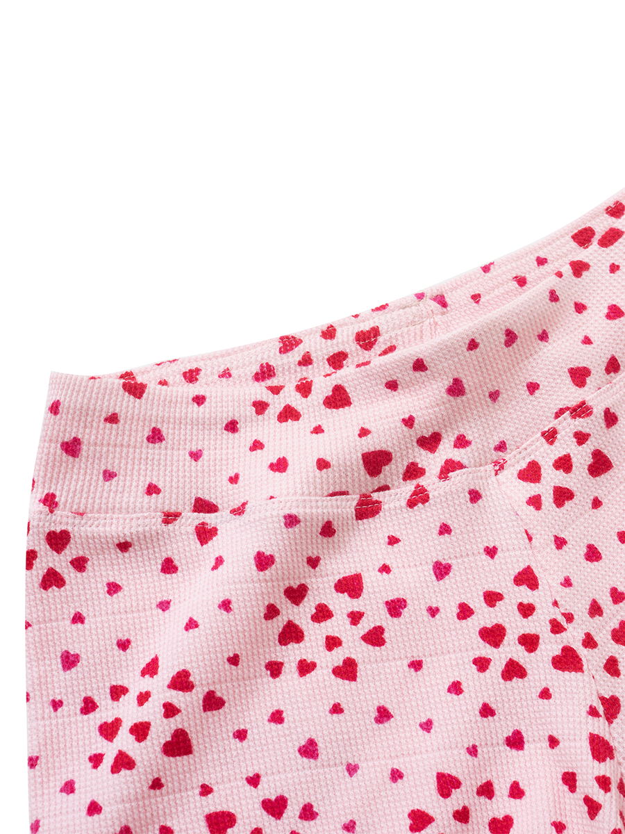 Close-up of waistband on pink heart print waffle shorts