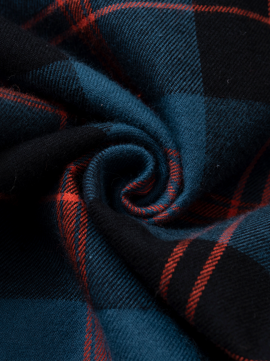 Close-up of royal blue brushed cotton plaid fabric for warm winter pyjamas.