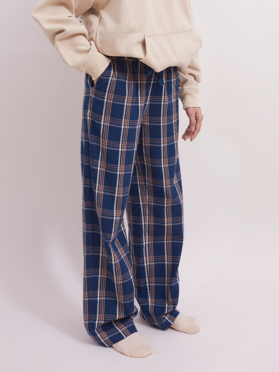 Side view of blue plaid tartan brushed cotton pyjama bottoms with pockets, warm weather pyjamas.