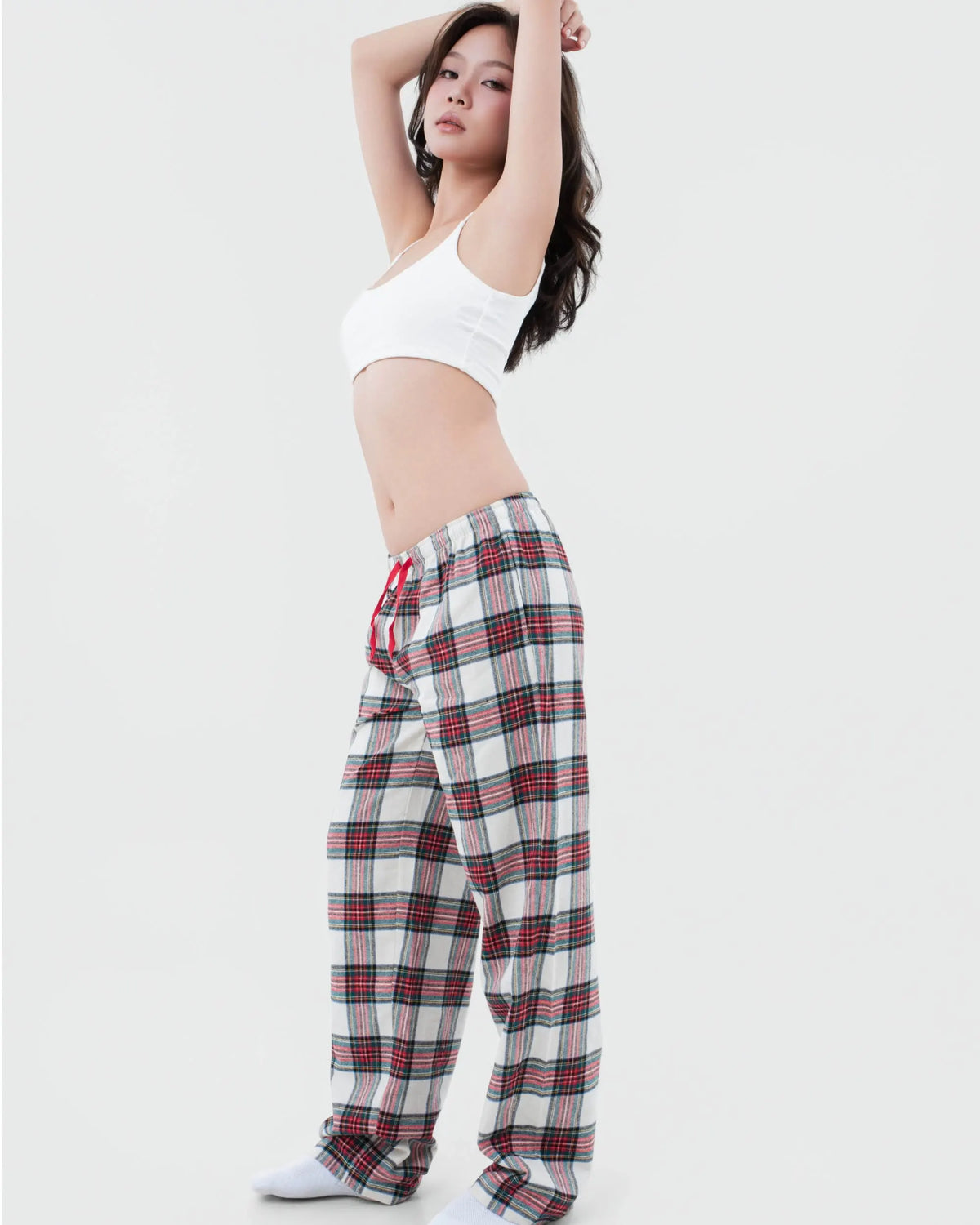Model showing the low-rise waistband of SleepyPants red blueberry check flannel pyjama bottoms