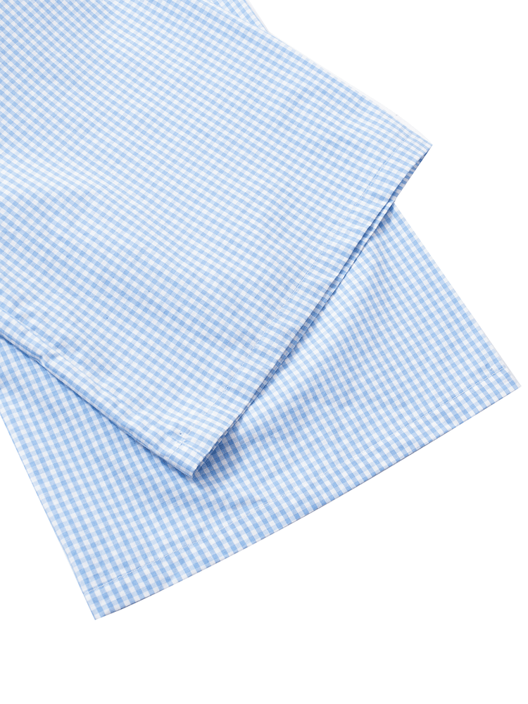 
                                            
                                                Close-up of the hem detail on the blue gingham mid-rise slim fit wide leg lounge pants, showing the clean finish and wide leg cut.
                                            
                                        