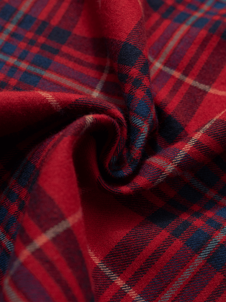 
                                            
                                                Close-up of red tartan brushed cotton fabric texture for winter pyjama pants.
                                            
                                        
