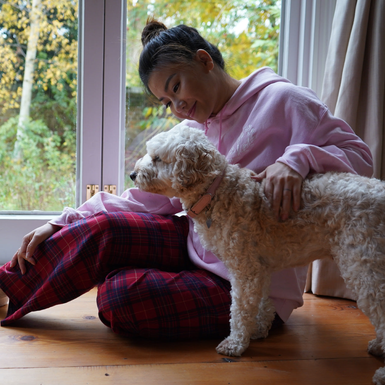 Red brushed flannel pyjama bottoms in a classic plaid pattern, ideal for cold weather with their soft and cozy fabric.