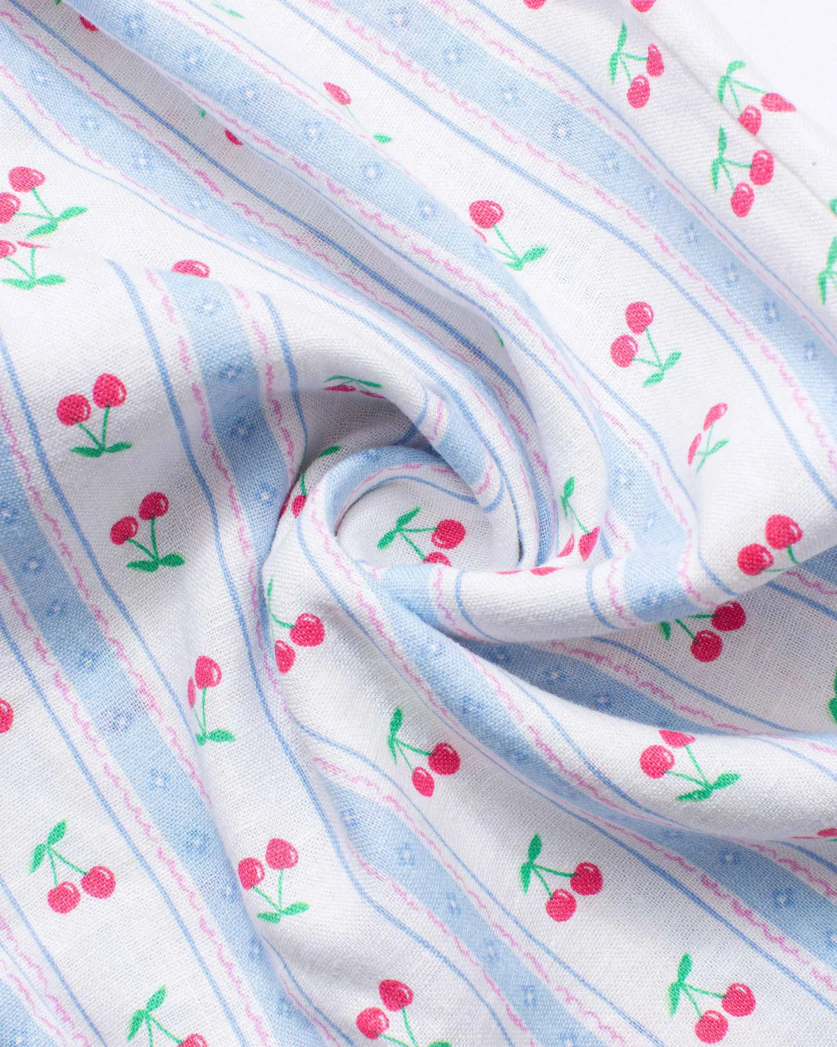 Close-up of red cherry print on pale blue striped linen fabric