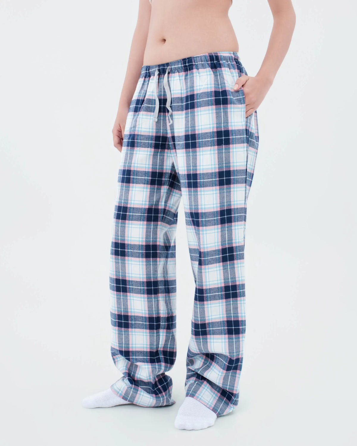 Three-quarter view of navy and pink tartan flannel pyjama bottoms showing the side pocket