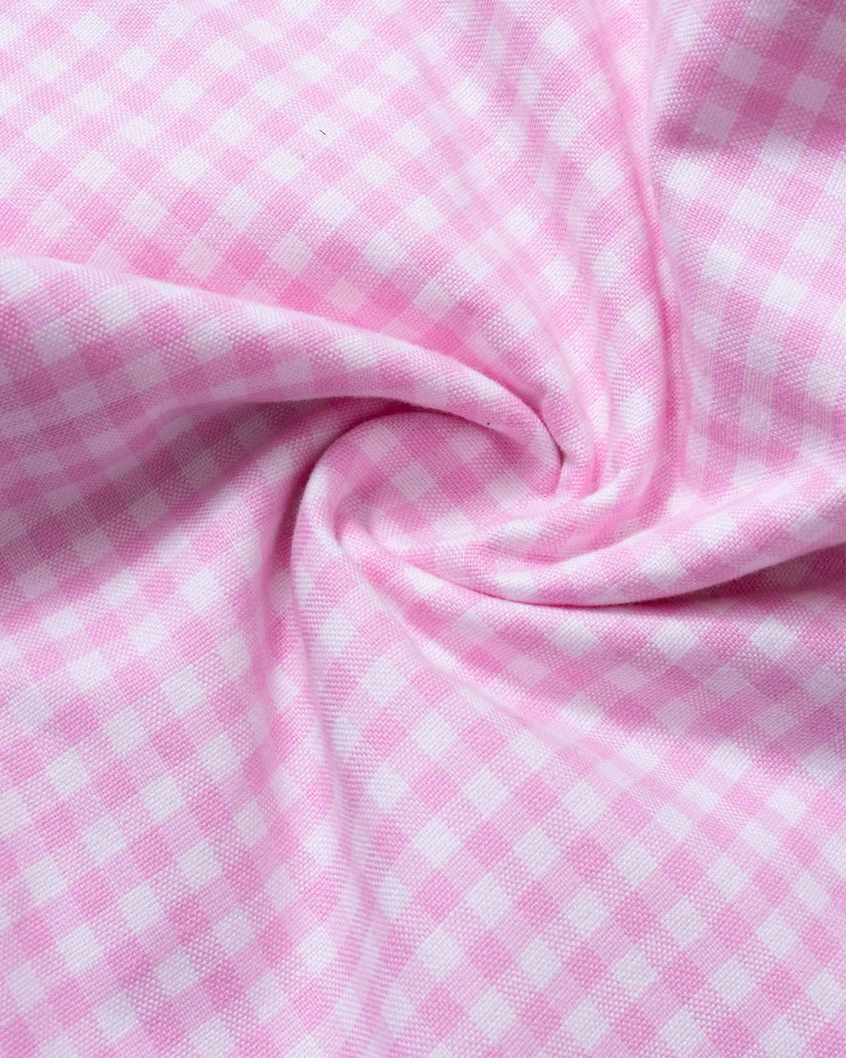 Close-up of pink and white mini-gingham cotton Oxford fabric