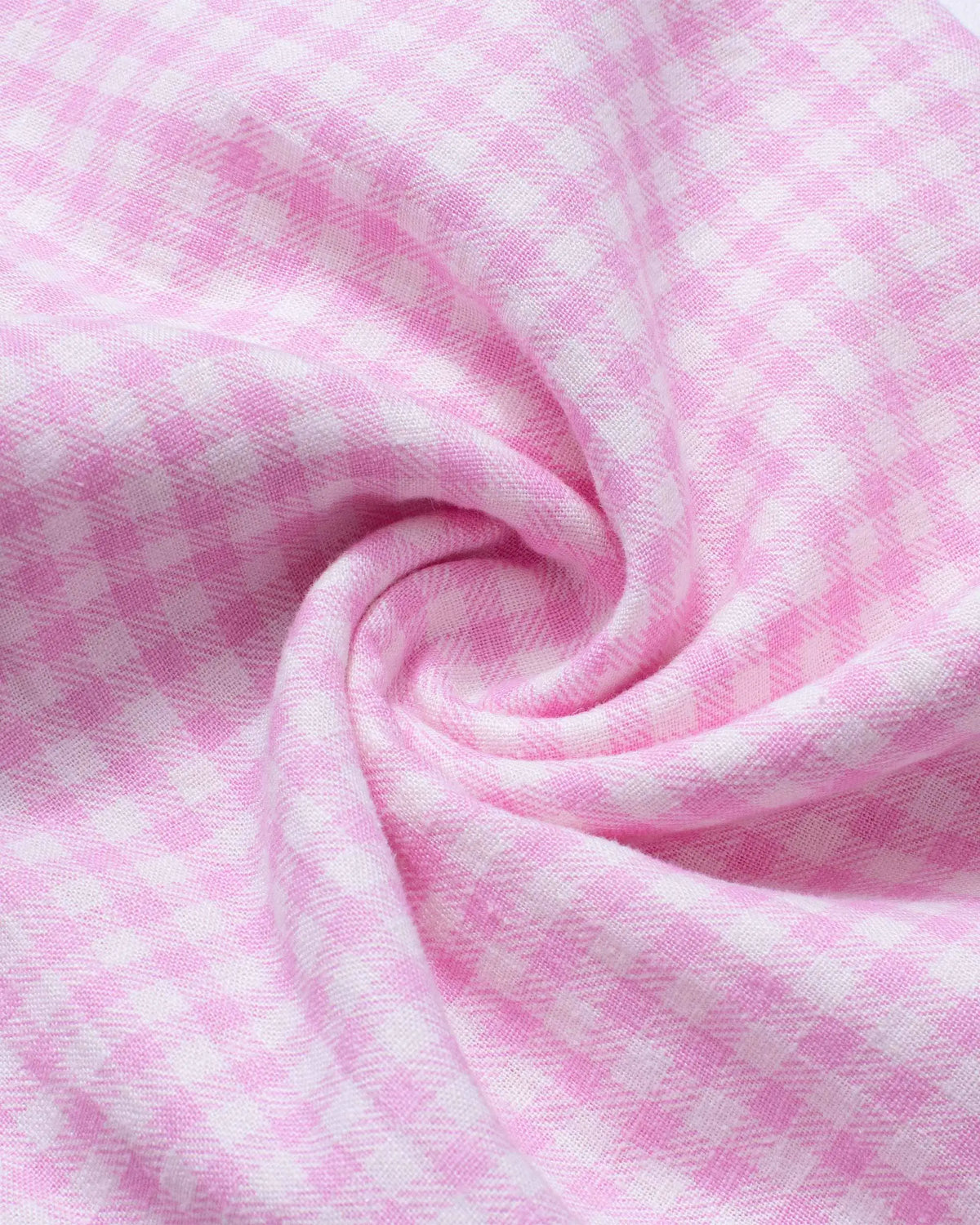 Close-up of soft pink and white gingham linen fabric